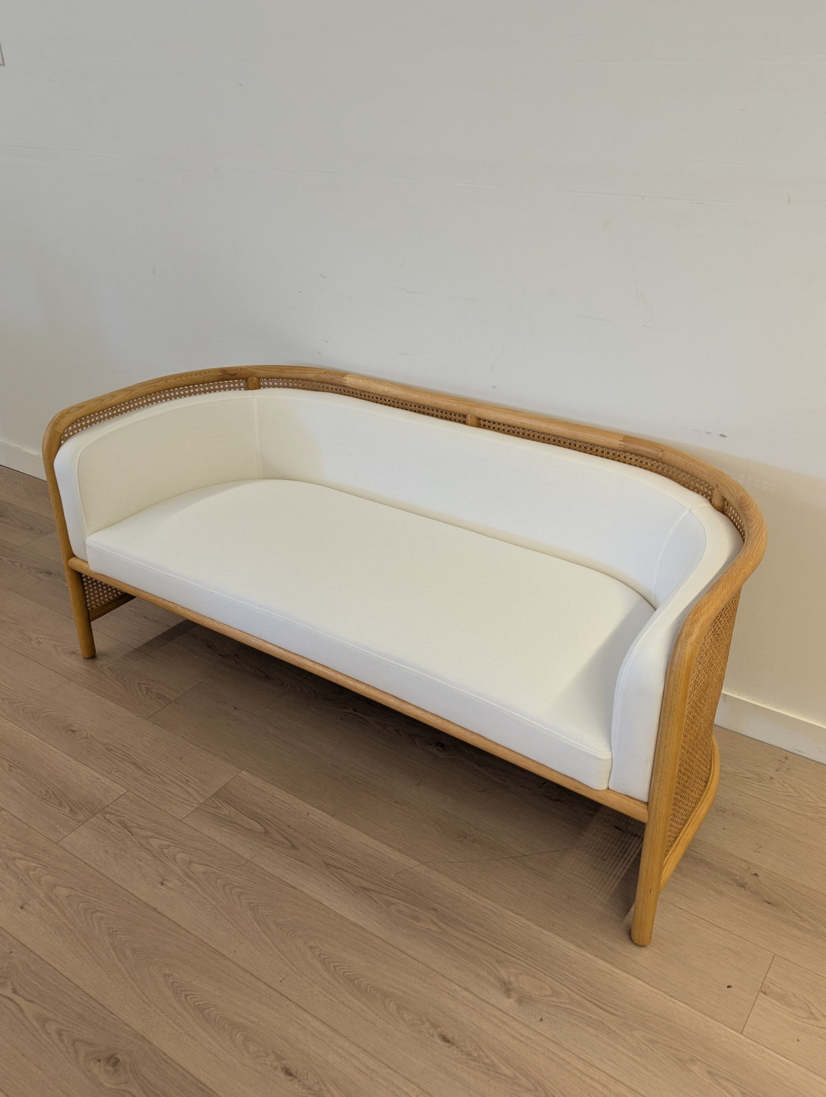 Crate & Barrel Fields Cane Settee with White Cushion by Leanne Ford